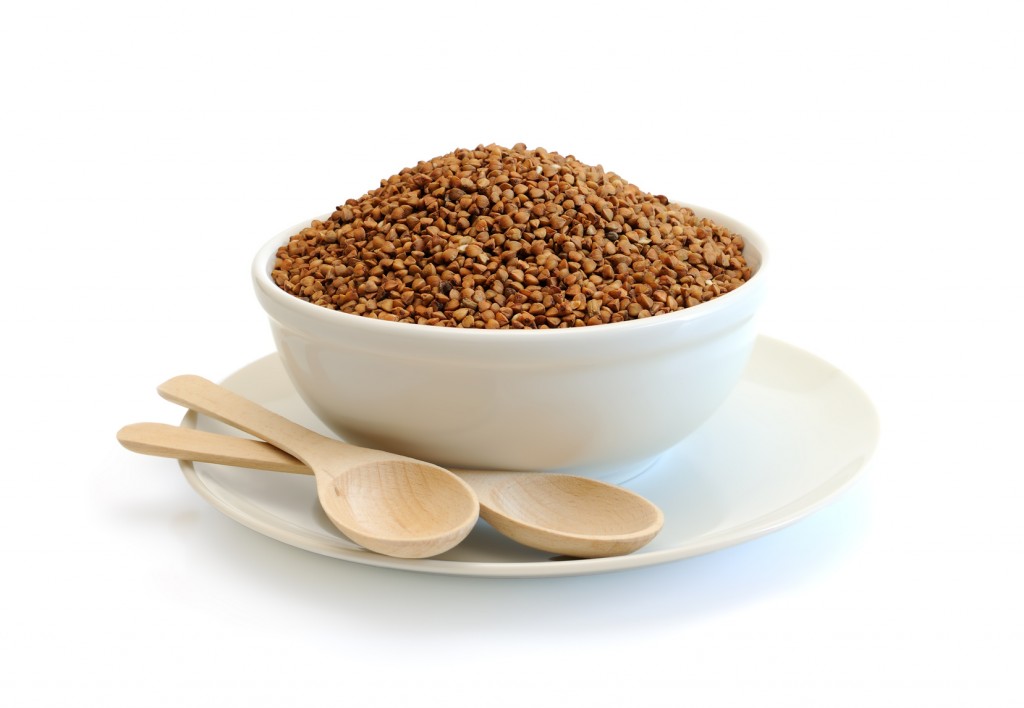 Buckwheat in a bowl on white background